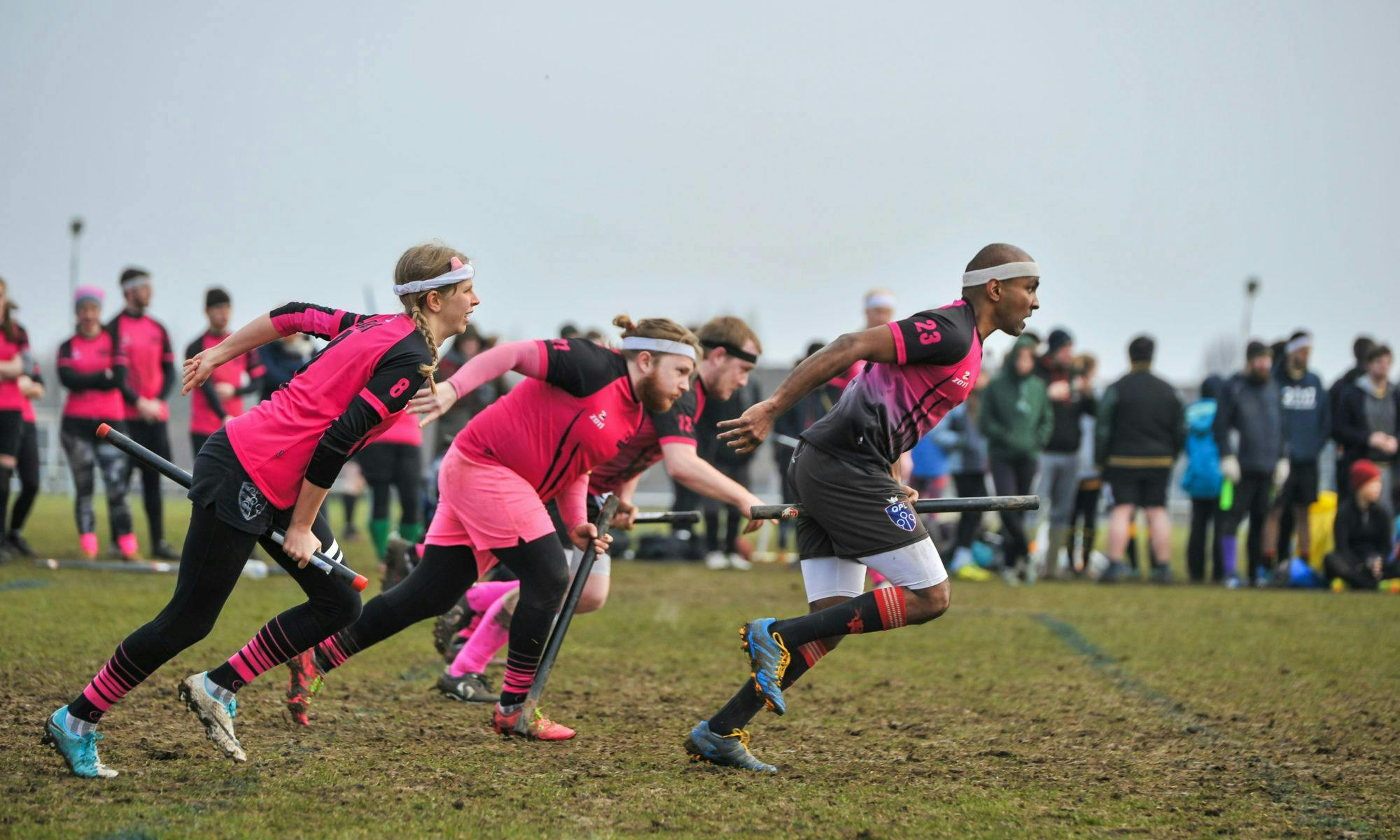 Velociraptors QC players run to the halfway line in a brooms up