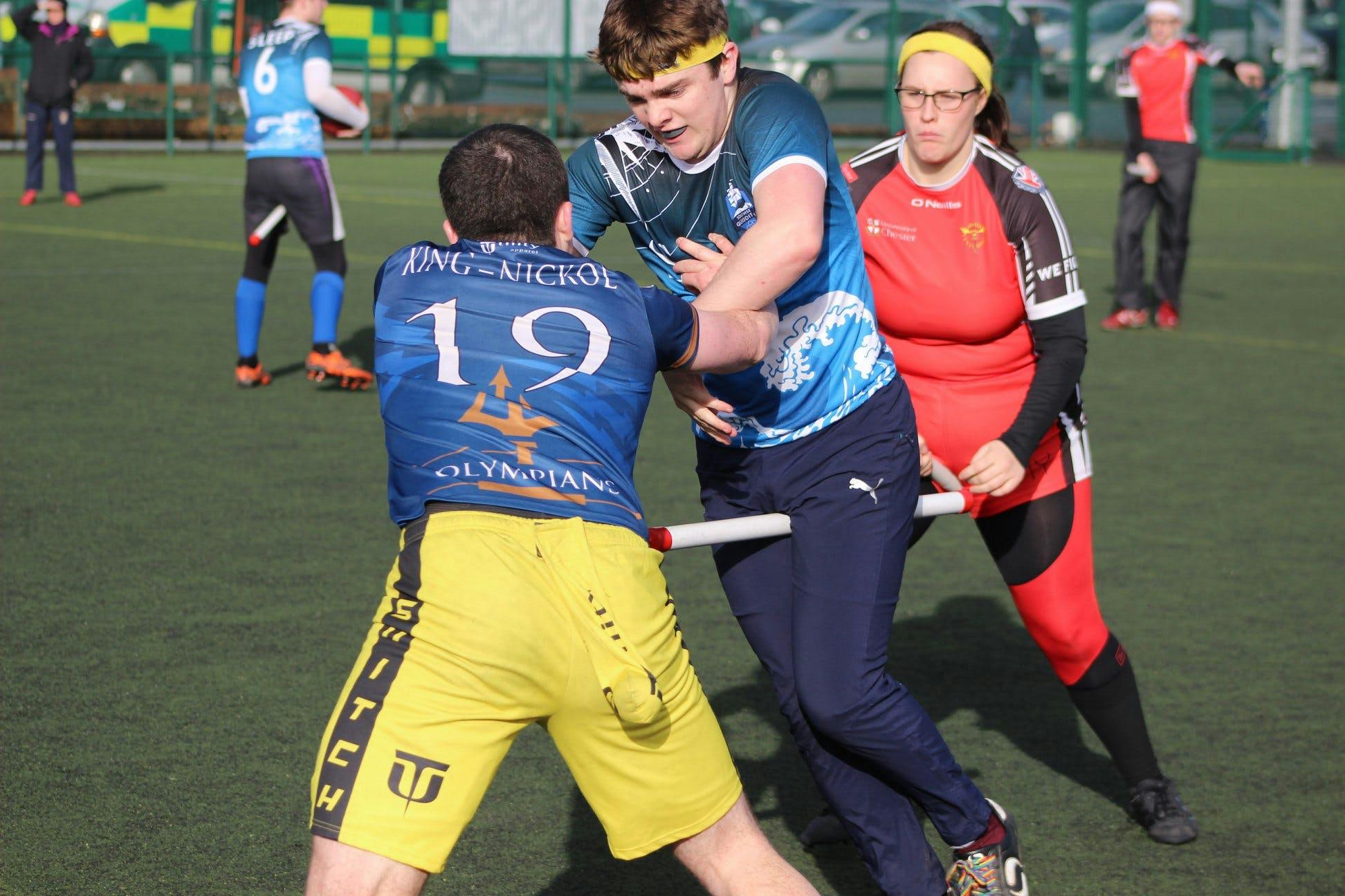A Southsea seeker wrestles with the snitch, James King-Nicholls, attempting to catch while a Chester seeker is blocked.