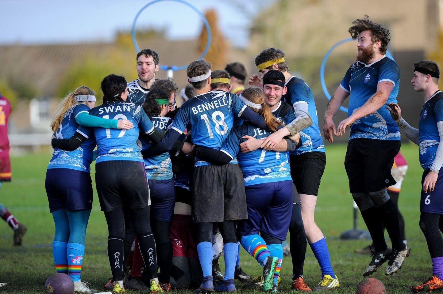 Southsea Quidditch celebrate in a group hug after winning a match