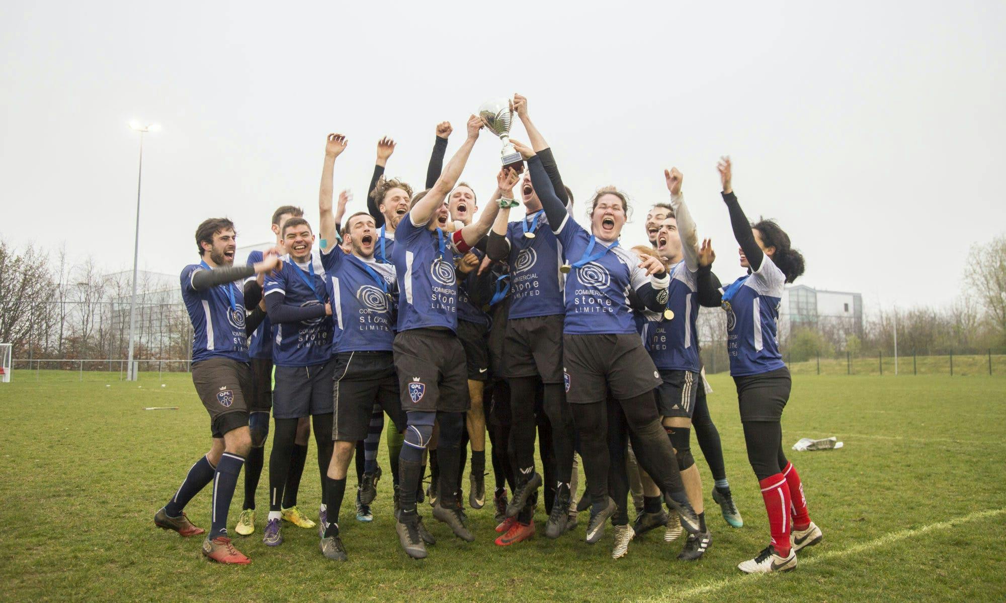 London Quidditch Club celebrate their BQC win by raising the trophy