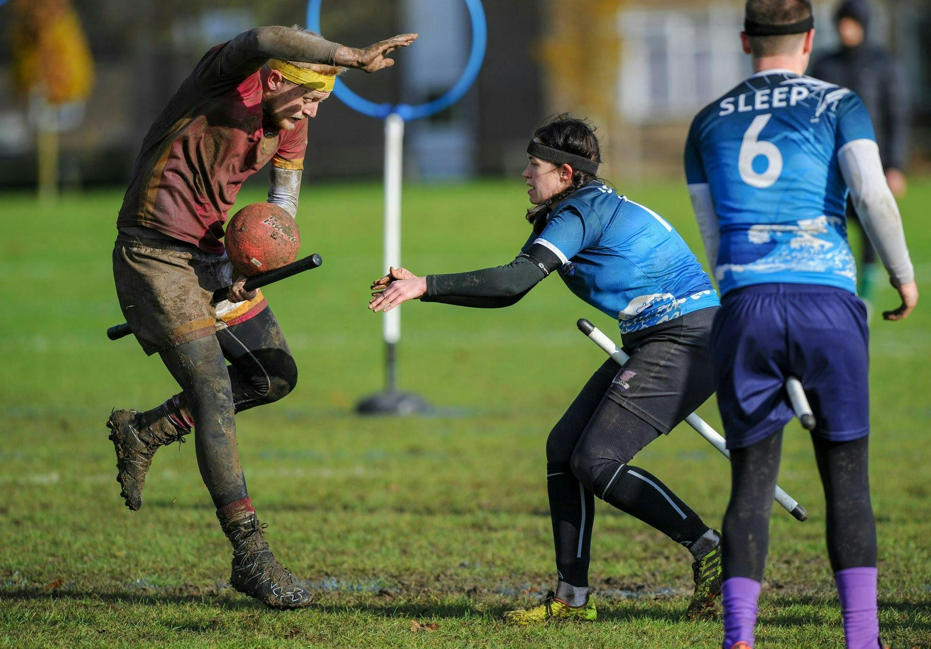 Southsea Quidditch Beater throws a bludger at Werewolves of London seeker who is attempting to avoid the ball